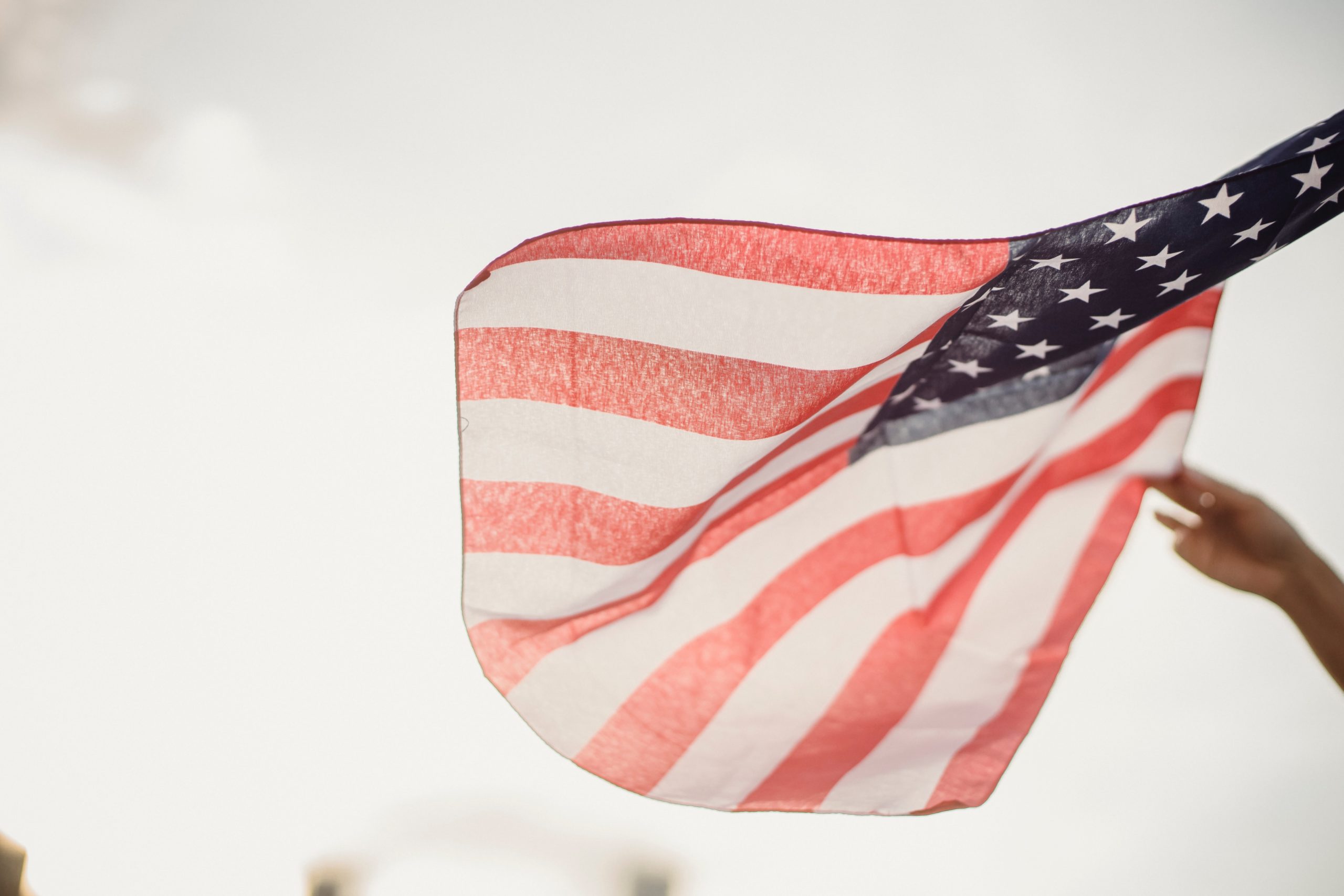 Under view of American flag being flown
